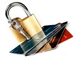 Photo of pad lock and keys on top of credit cards to illustrate the message of keeping your credit cards safe