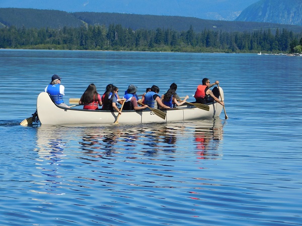 Cst Rabut with kids in Big Canoe on a Lake