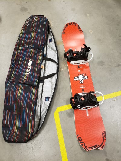 •	Snowboard one is a black and red Burton Keith Haring snowboard with multi-coloured Burton bag