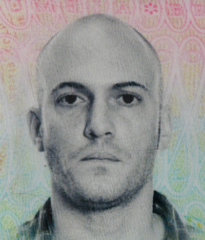 Suspect 1 is a Caucasian man, appears 30-years-old, bald, with a narrow face, arched eyebrows and a slightly crooked nose.