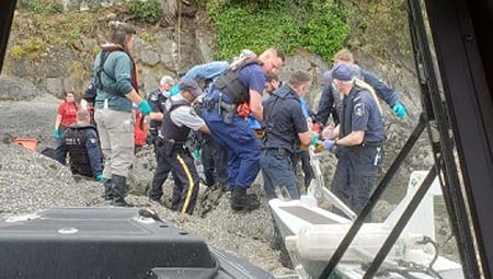 First responders help remove a man from water  