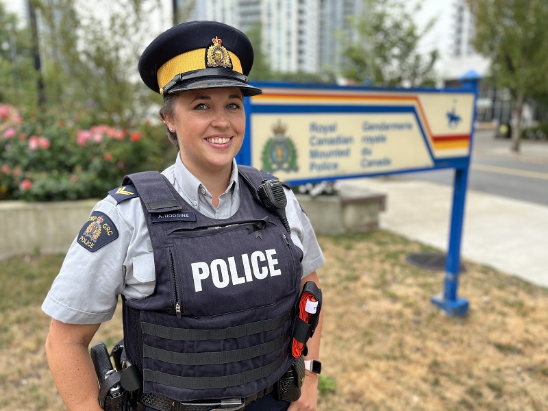 Cpl. Hodgins standing in front of the Coquitlam RCMP detachment 