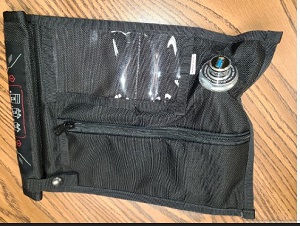 Black fabric bag with nozzle and sipper on the outside 