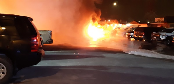 Photo of Sunshine Inn parking lot fire.