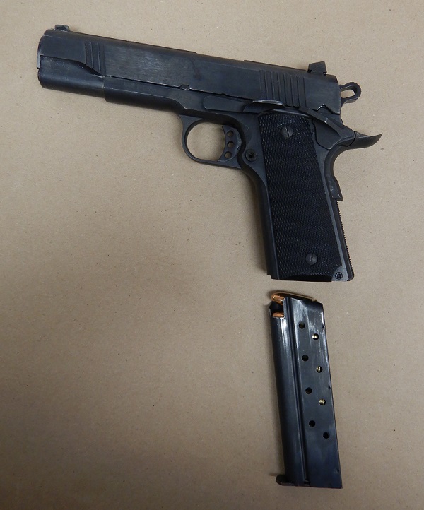 Black semi-automatic handgun with a loaded magazine 