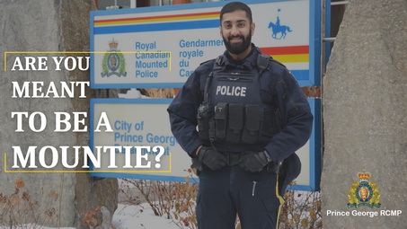 Police officer standing in front of the PGRCMP detachment with the words "Are you meant to be a Mountie?"